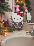 Absolute Prints Hello Kitty gingerbread soap dispenser with a pink pump, styled on a bathroom vanity for the holidays.