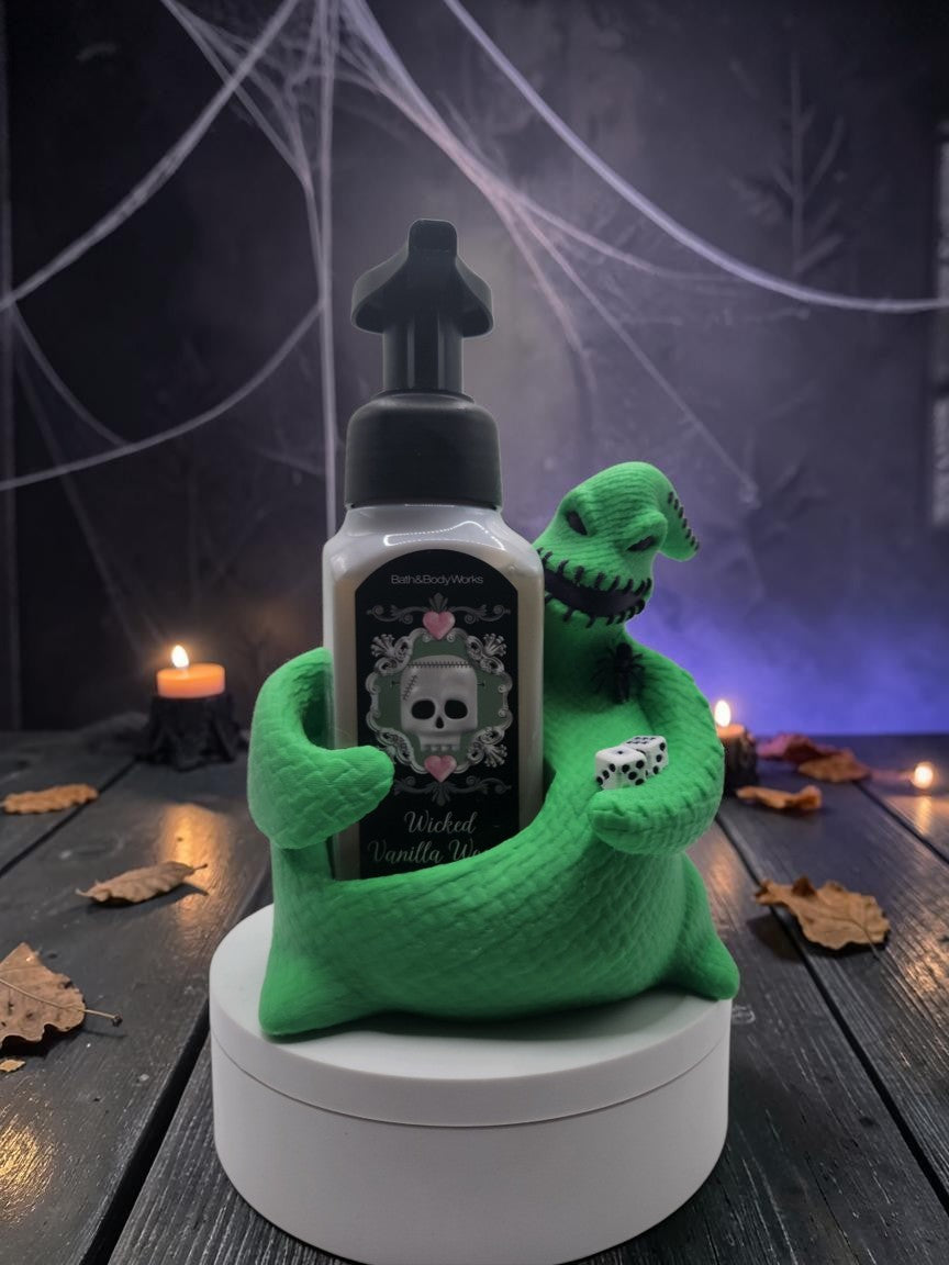 Absolute Prints Oogie Boogie soap dispenser holder in vibrant green with dice, holding a foaming soap bottle.